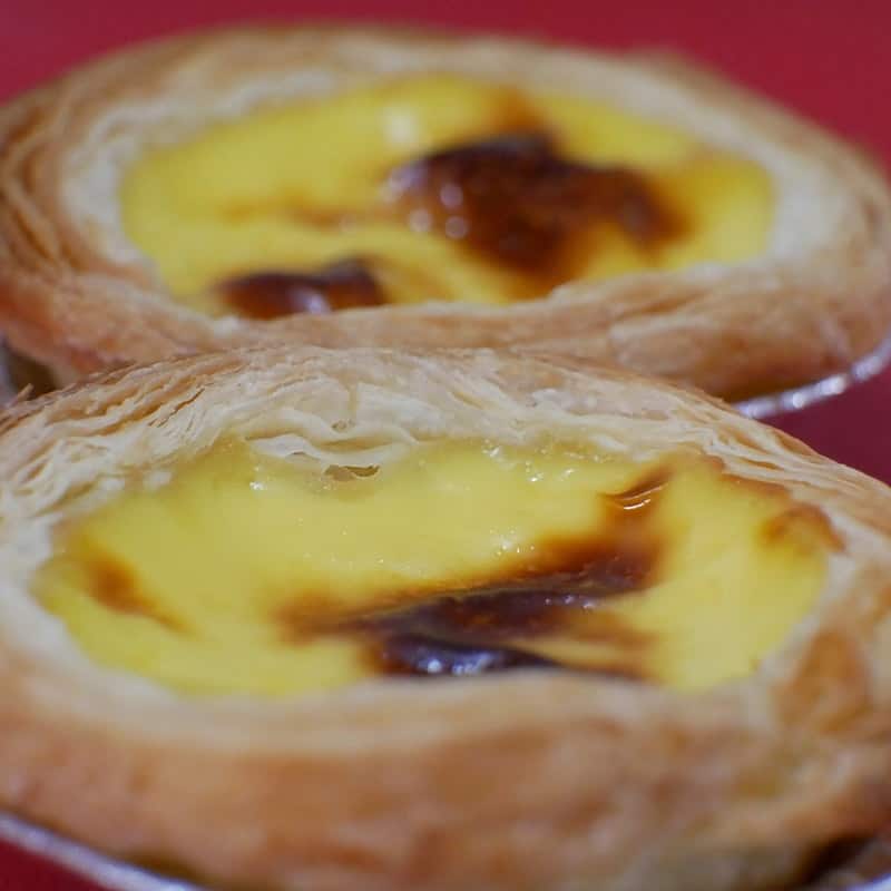 Two vanilla custard tarts with caramelised tops