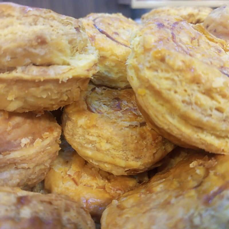 A stack of caramelised, sugar-crusted kouign-amann