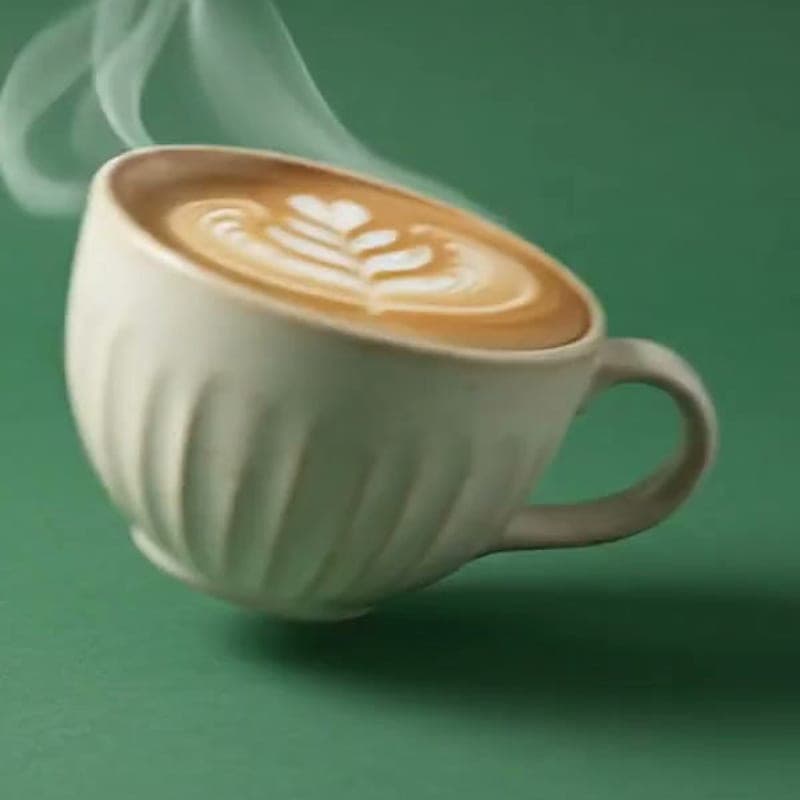 Cortado in a small ceramic cup with a fine milk crema