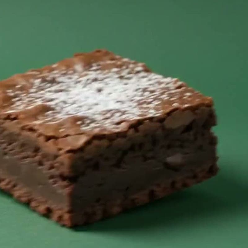 Espresso brownie with a crackled top and cocoa nibs