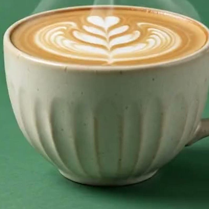 Double espresso in a fluted ceramic cup