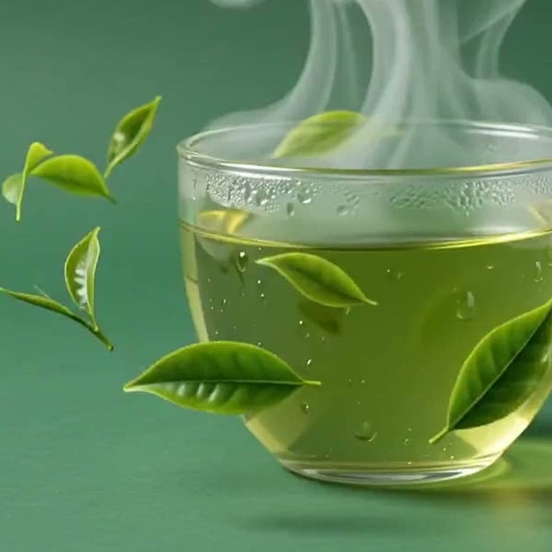 Yuzu iced tea in a tall glass with citrus and tea leaves